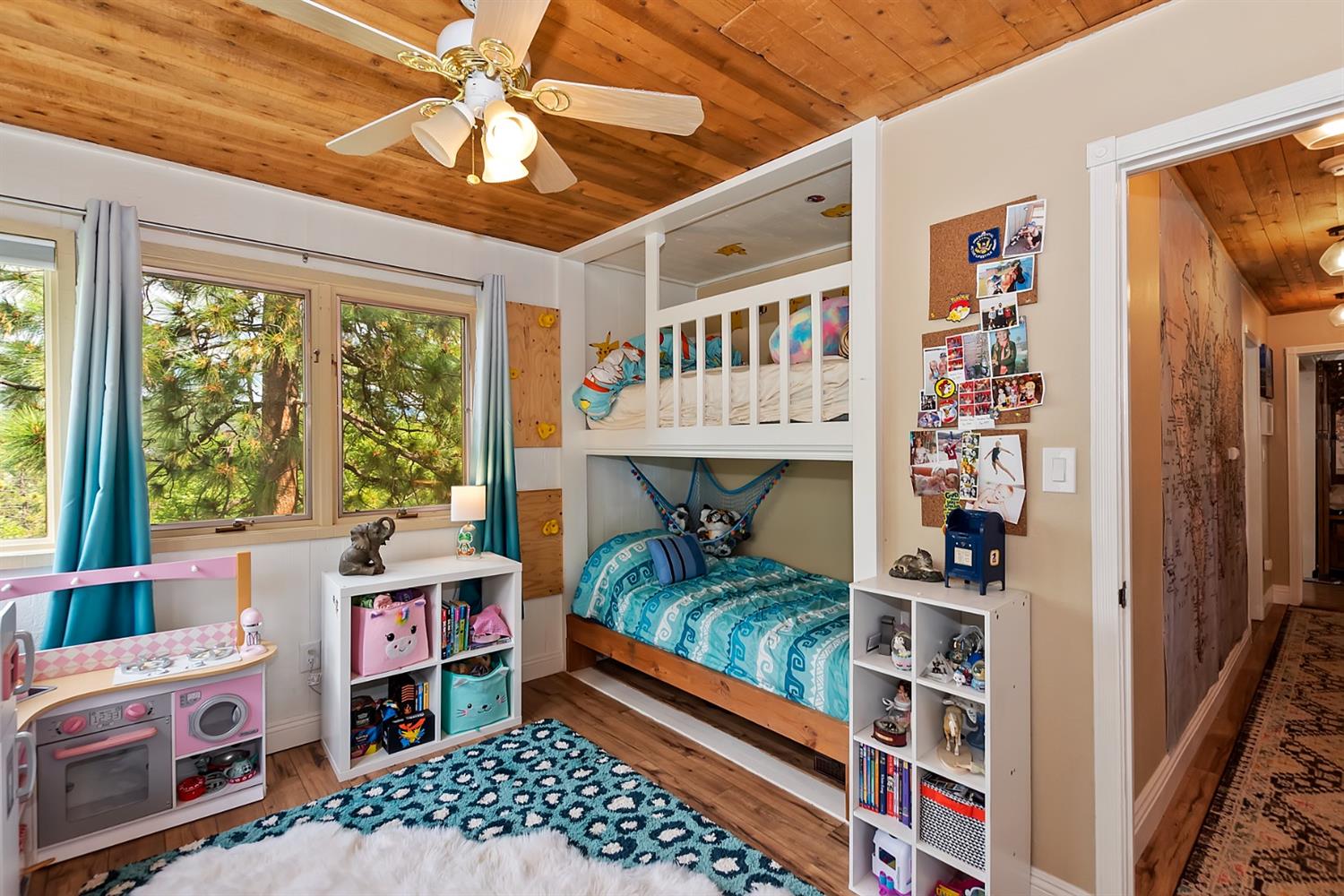 28277 Arbon Lane Lake Arrowhead, CA 92352 - Photo 31 of 50 a bedroom with furniture and a book shelf