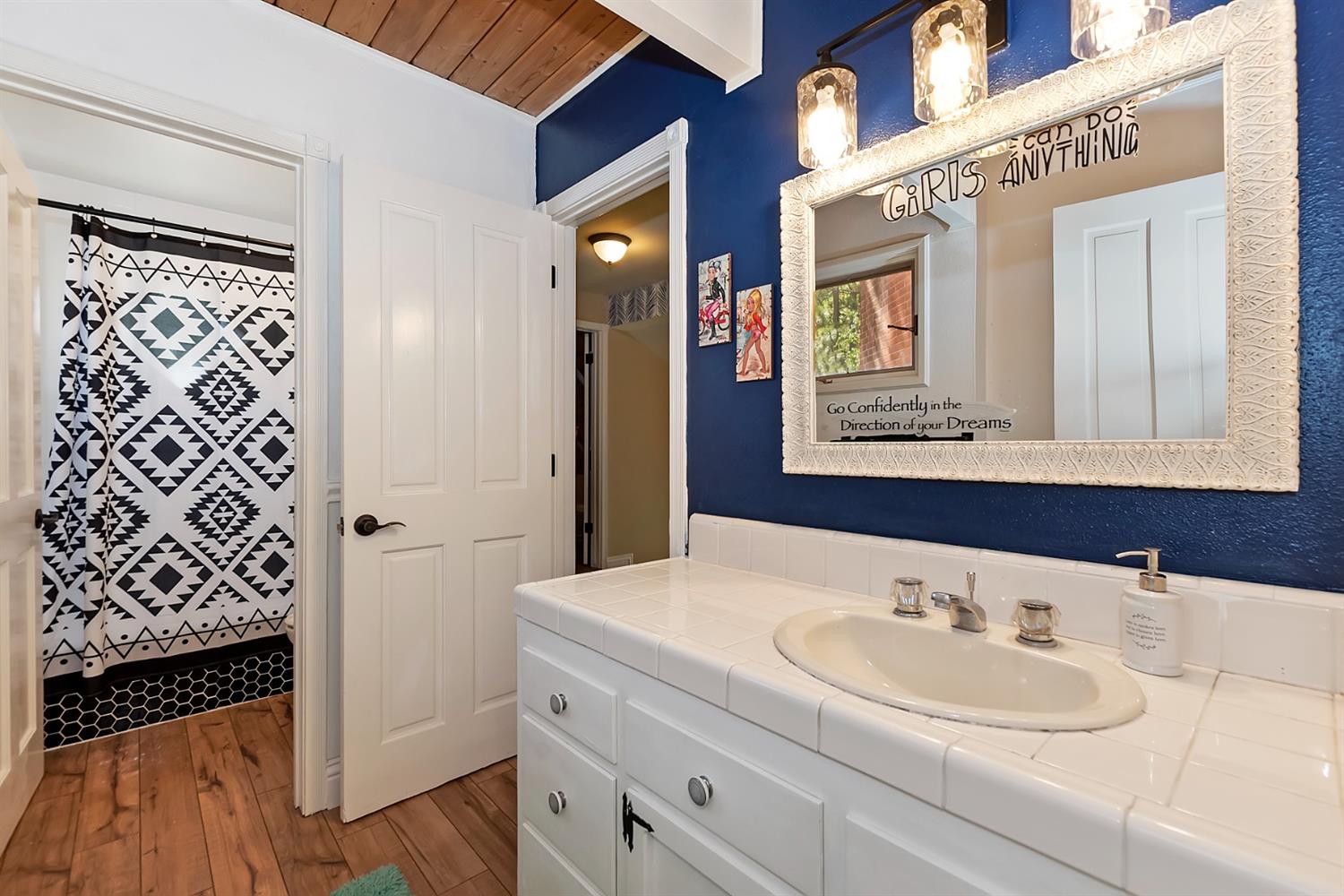 28277 Arbon Lane Lake Arrowhead, CA 92352 - Photo 34 of 50 a bathroom with a sink and a mirror
