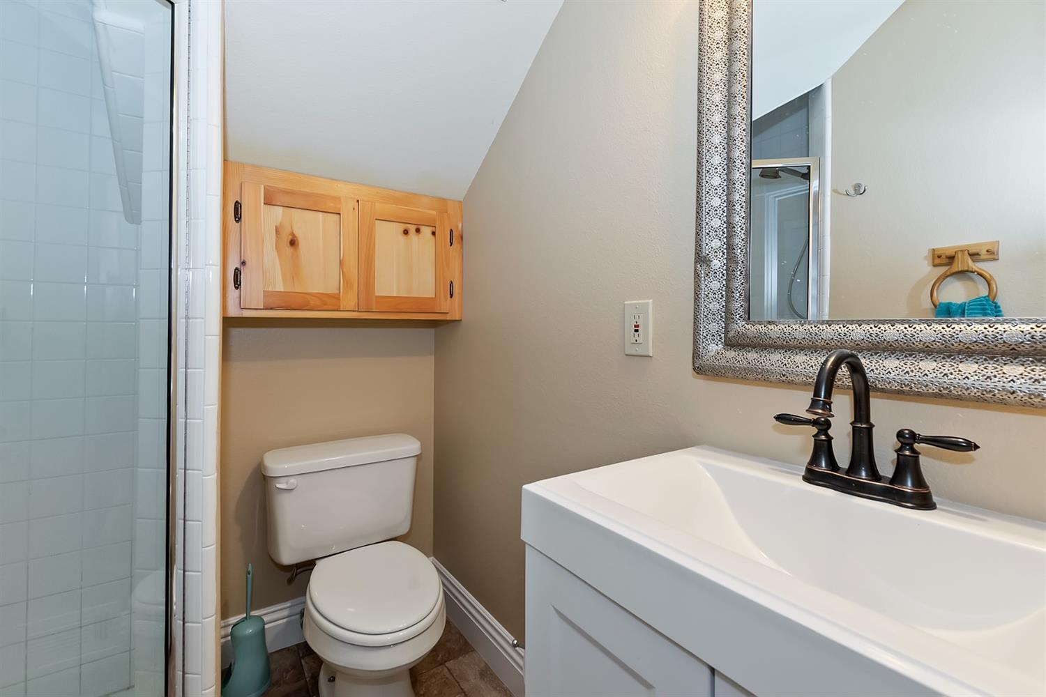 28277 Arbon Lane Lake Arrowhead, CA 92352 - Photo 40 of 50 a bathroom with a toilet sink and mirror