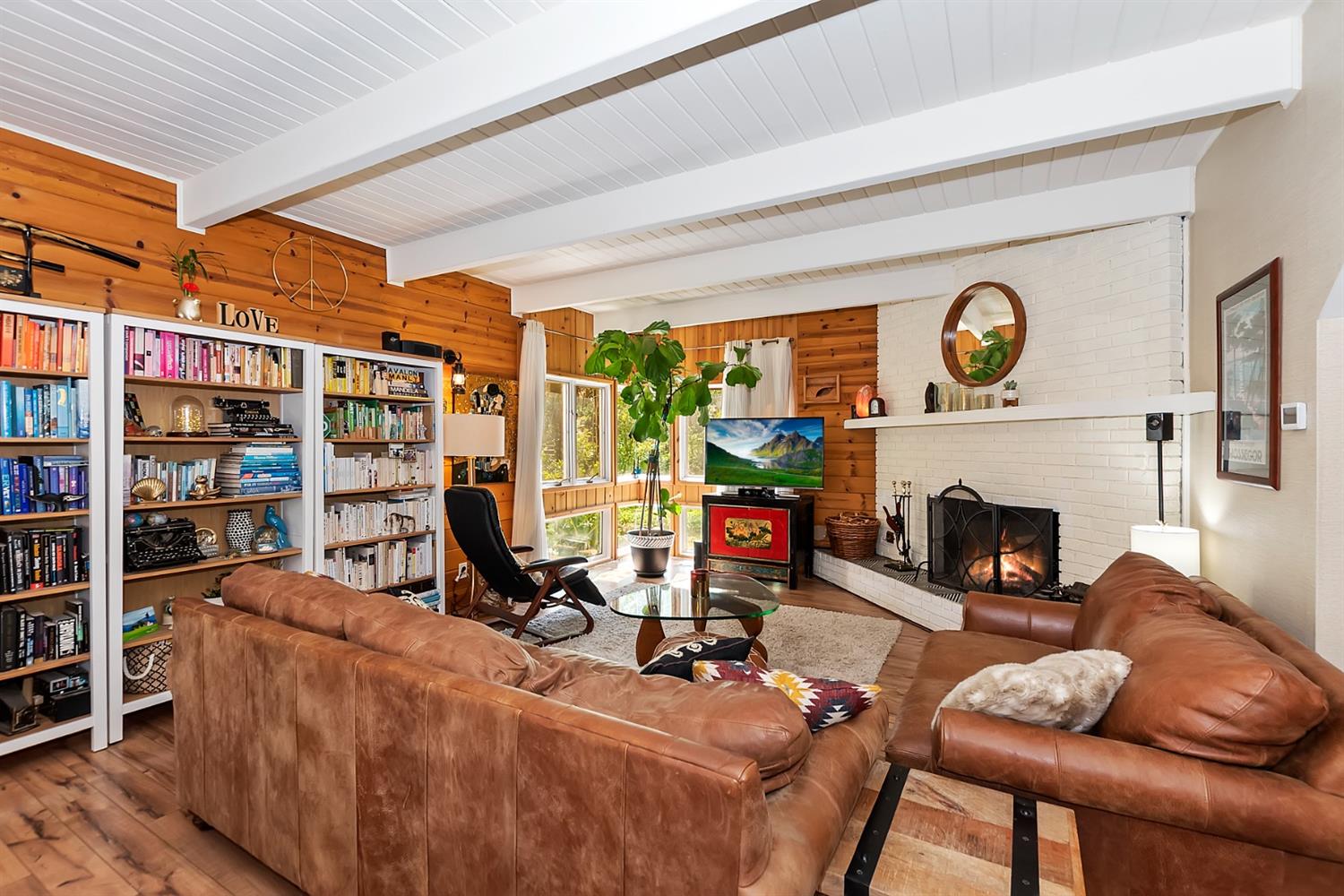 28277 Arbon Lane Lake Arrowhead, CA 92352 - Photo 5 of 50 a living room with furniture a fireplace and a bookshelf