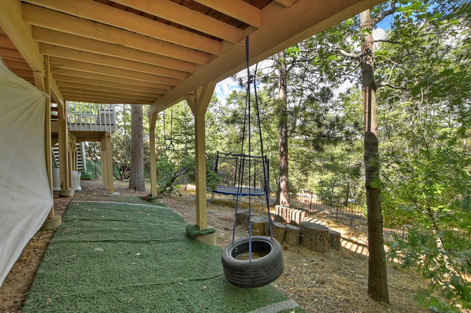 28277 Arbon Lane Lake Arrowhead, CA 92352 - Photo 47 of 50 a view of a porch with chairs and backyard