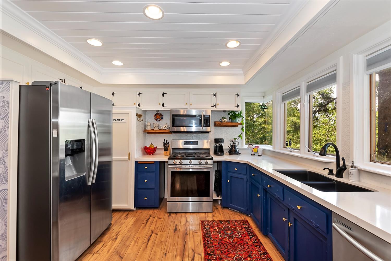 28277 Arbon Lane Lake Arrowhead, CA 92352 - Photo 9 of 50 a kitchen with stainless steel appliances granite countertop a sink stove and refrigerator