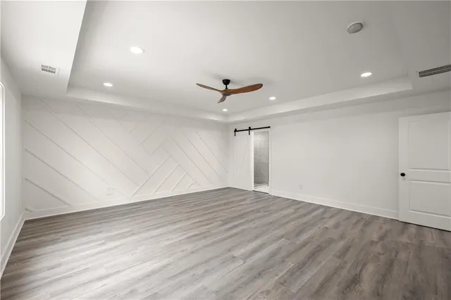 a bathroom with a bathtub shower and window