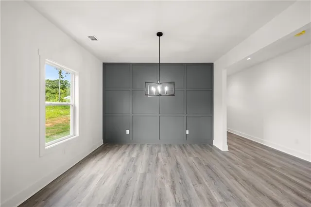 a view of a room with window wooden floor and windows