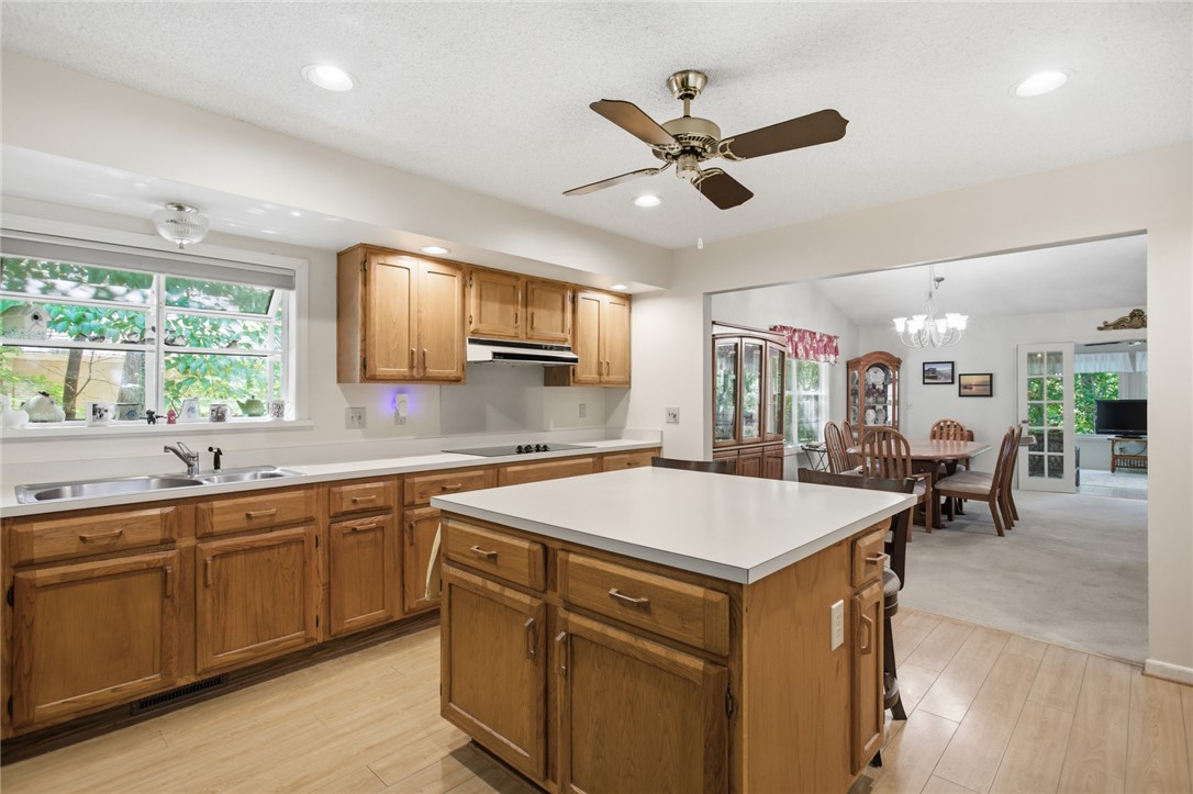 6 Tradewinds Way Salem, SC 29676 - Photo 6 of 50 This spacious kitchen, featuring a central island, flows into an elegant dining area, perfect for entertaining.