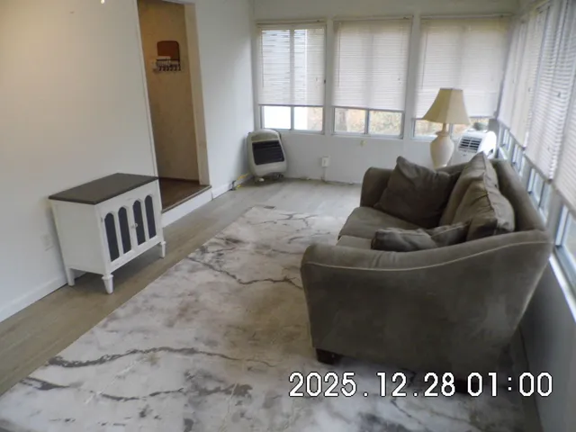 a living room with furniture and a gate