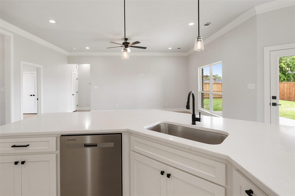 505 Limestone Circle Mabank, TX 75147 - Photo 13 of 37 a kitchen with a sink a counter space and appliances