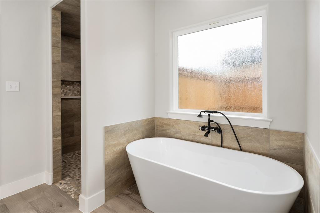 505 Limestone Circle Mabank, TX 75147 - Photo 20 of 37 a white bath tub sitting next to a window