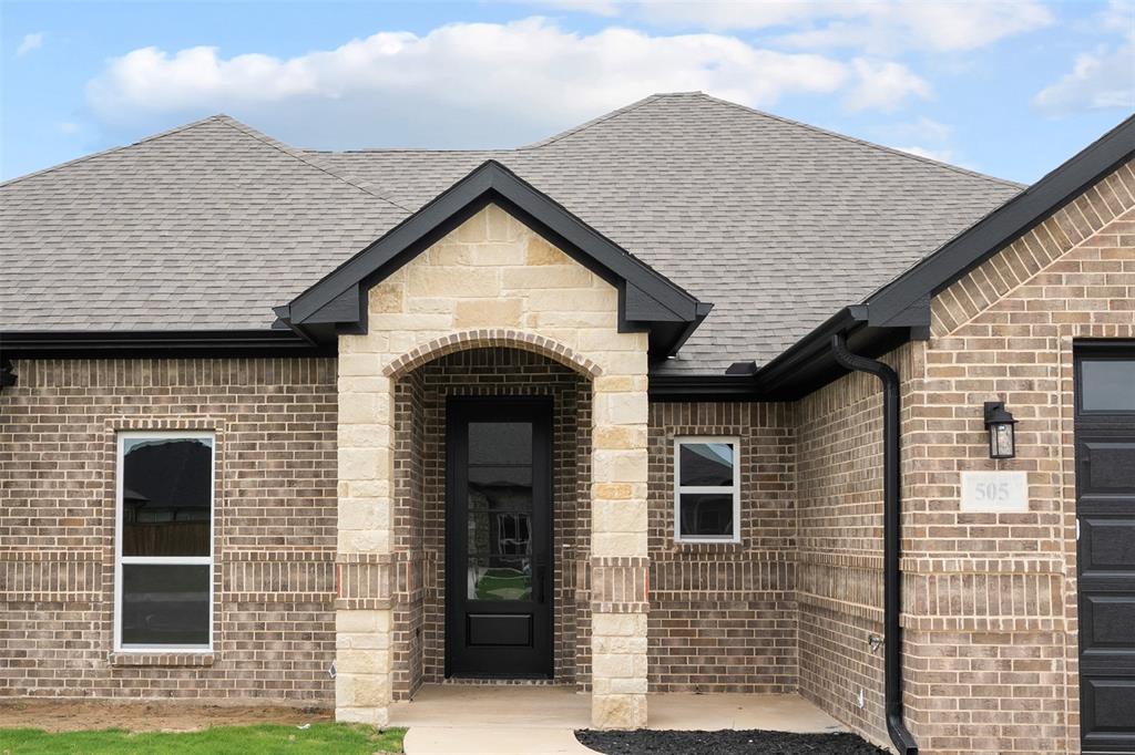 505 Limestone Circle Mabank, TX 75147 - Photo 2 of 37 a front view of a house with a garage