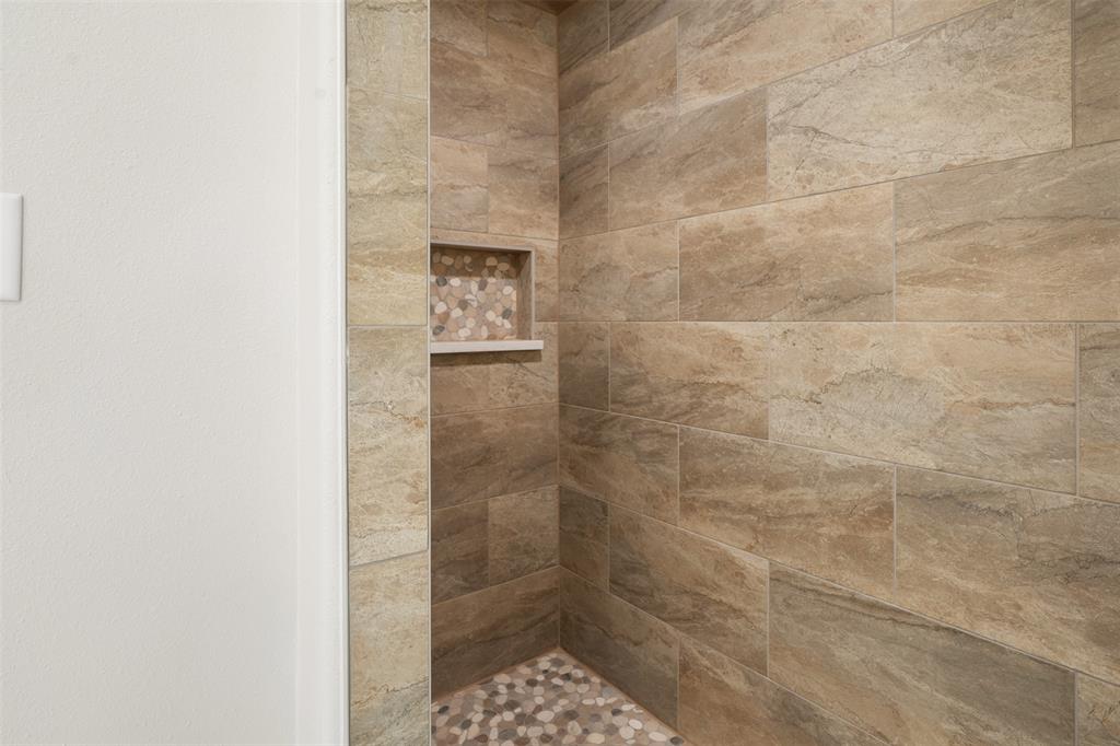 505 Limestone Circle Mabank, TX 75147 - Photo 21 of 37 a bathroom with a shower