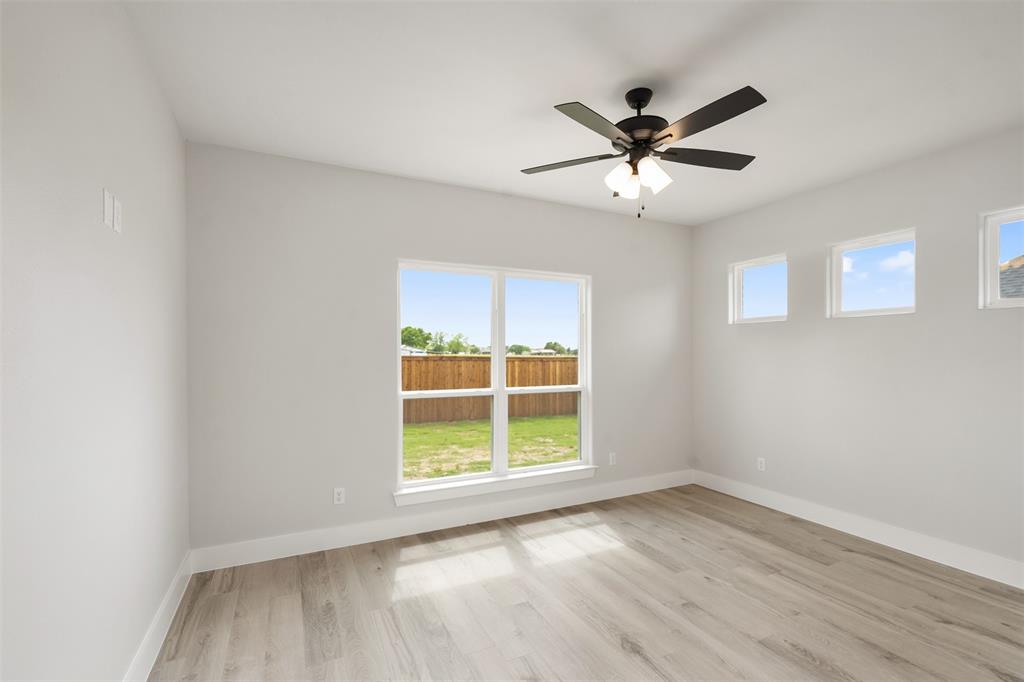 505 Limestone Circle Mabank, TX 75147 - Photo 24 of 37 wooden floor in an empty room with a window