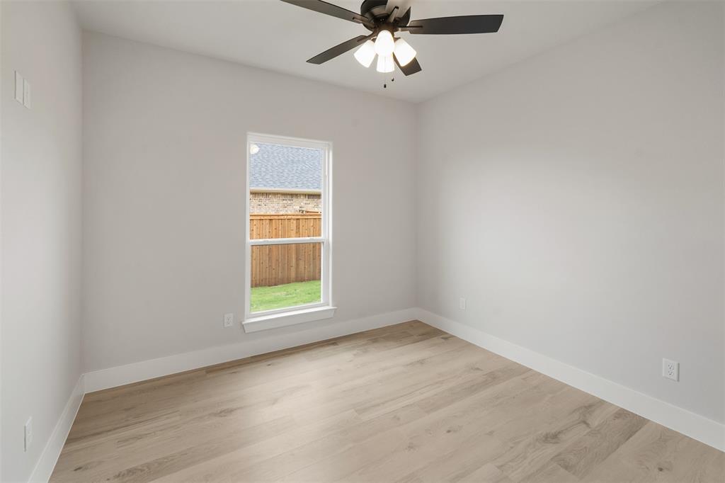 505 Limestone Circle Mabank, TX 75147 - Photo 25 of 37 an empty room with a window and ceiling fan