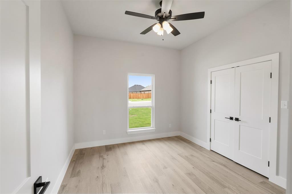 505 Limestone Circle Mabank, TX 75147 - Photo 28 of 37 wooden floor in an empty room with a window