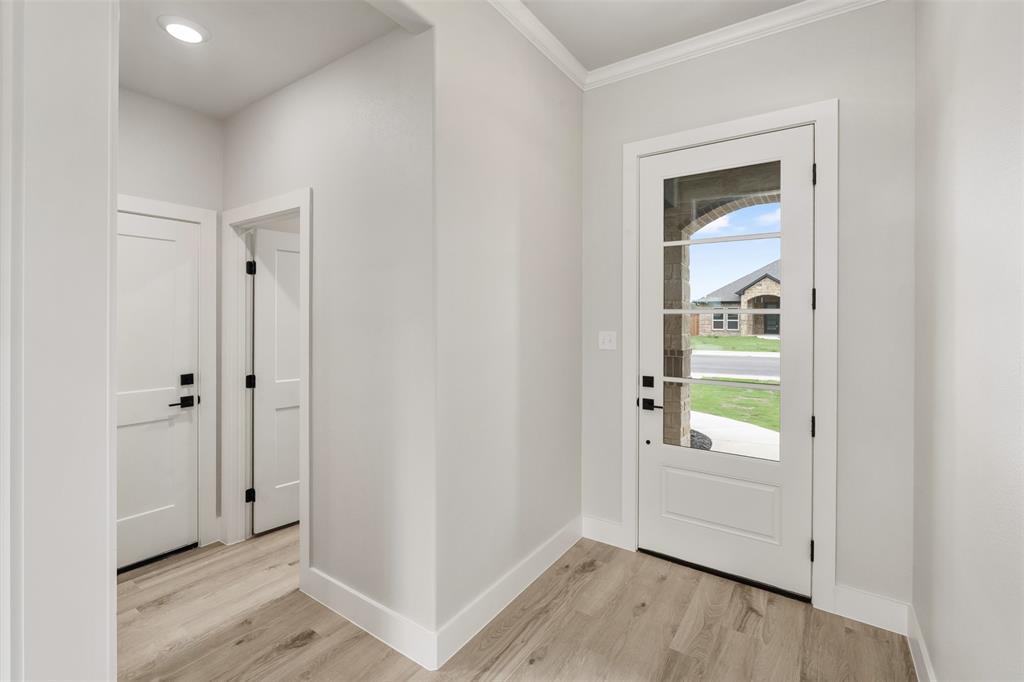 505 Limestone Circle Mabank, TX 75147 - Photo 3 of 37 a view of an entryway with wooden floor