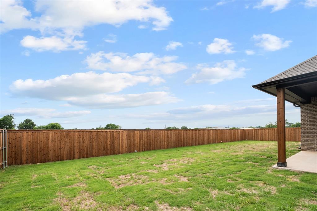 505 Limestone Circle Mabank, TX 75147 - Photo 31 of 37 a view of backyard with wooden fence