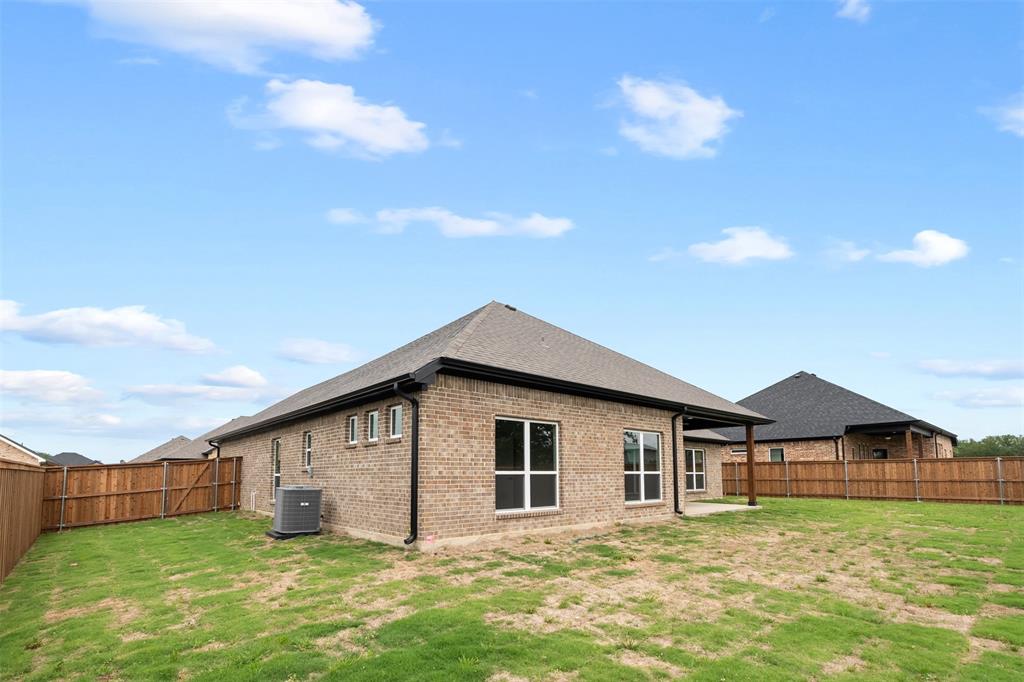 505 Limestone Circle Mabank, TX 75147 - Photo 33 of 37 a big house with a big yard and more windows