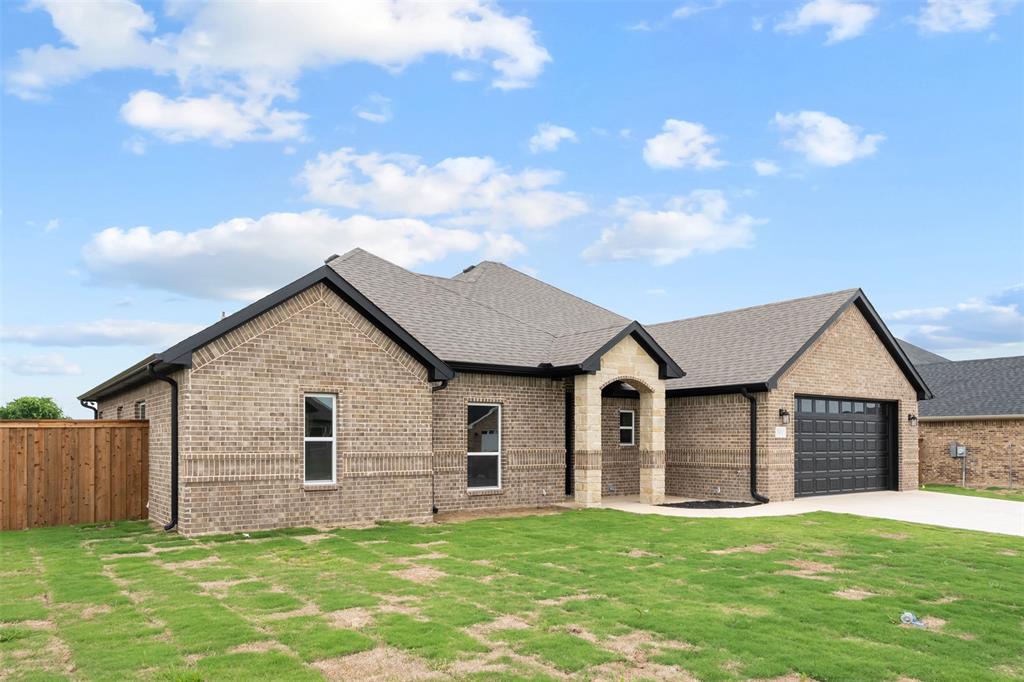 505 Limestone Circle Mabank, TX 75147 - Photo 35 of 37 a front view of a house with a yard and garage
