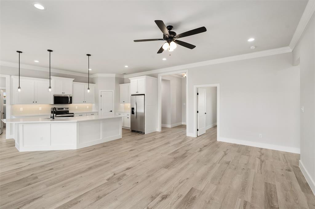 505 Limestone Circle Mabank, TX 75147 - Photo 6 of 37 a view of a kitchen with a sink and wooden floor