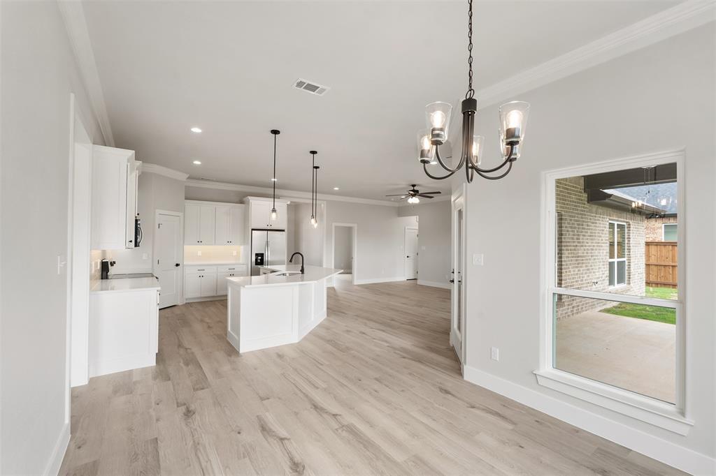 505 Limestone Circle Mabank, TX 75147 - Photo 9 of 37 a view of a kitchen center island and stainless steel appliances