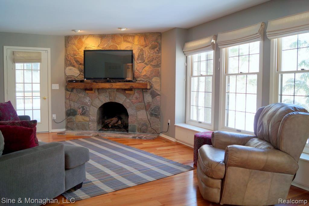 1334 Hathaway Rising Rochester, MI 48306 - Photo 17 of 36 Gas burning stone fireplace family room