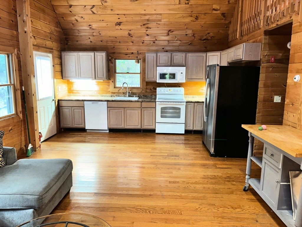 35 Tecumseh Road Wellfleet, MA 02667 - Photo 23 of 24 a kitchen with stainless steel appliances a refrigerator and a stove