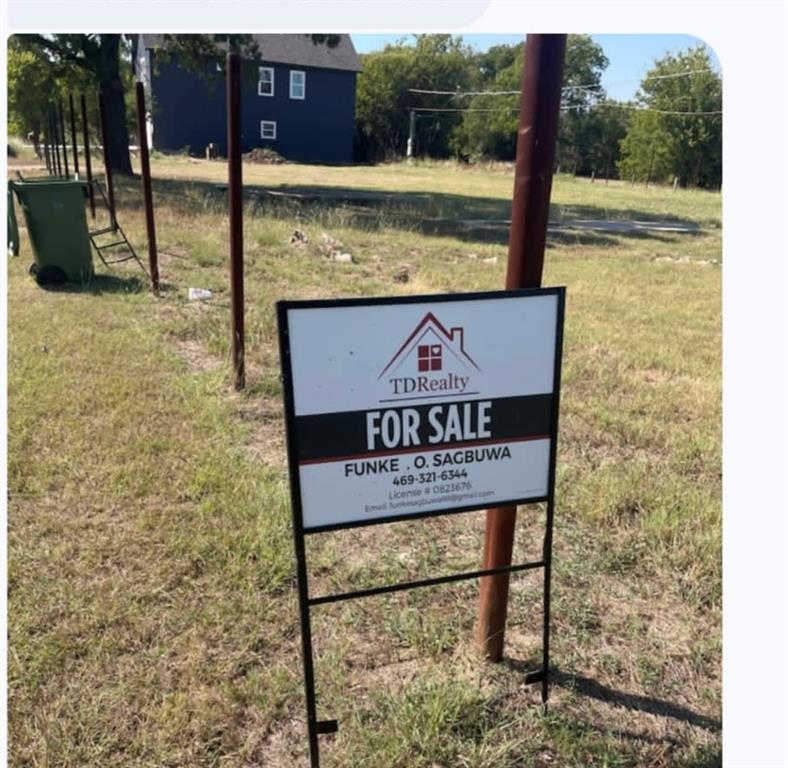 1111 Bell Street Arlington, TX 76001 - Photo 2 of 2 a sign on the side of a building