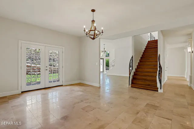 a view of a pathway with a tree in the background
