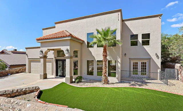 a view of kitchen with refrigerator and cabinets