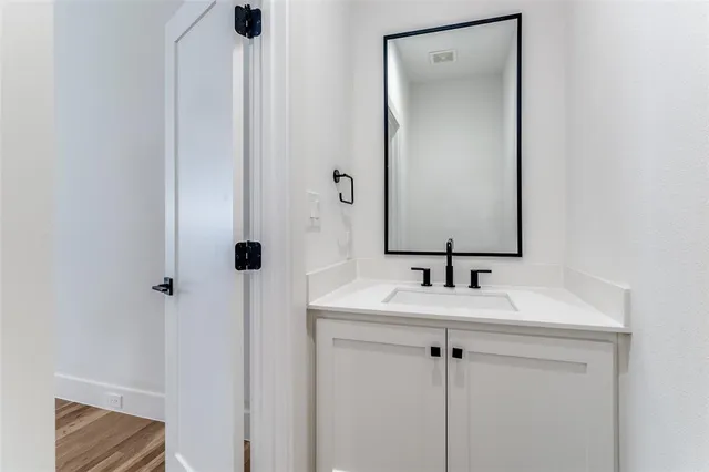a kitchen with a table and chairs
