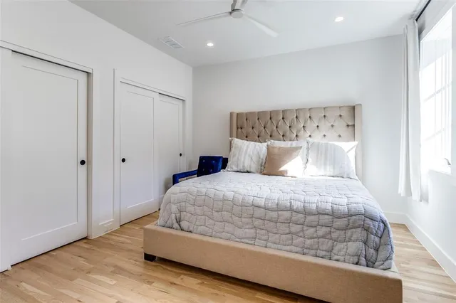 a bedroom with a bed and window