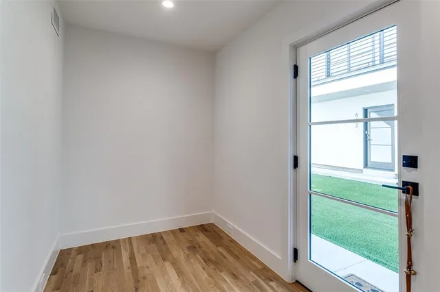 a view of room with window and hardwood