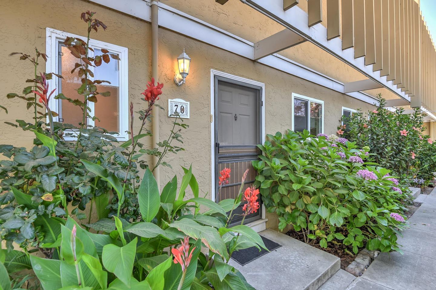 836 Pomeroy Avenue, Unit 70 Santa Clara, CA 95051 - Photo 1 of 17 a backyard of a house with lots of green space