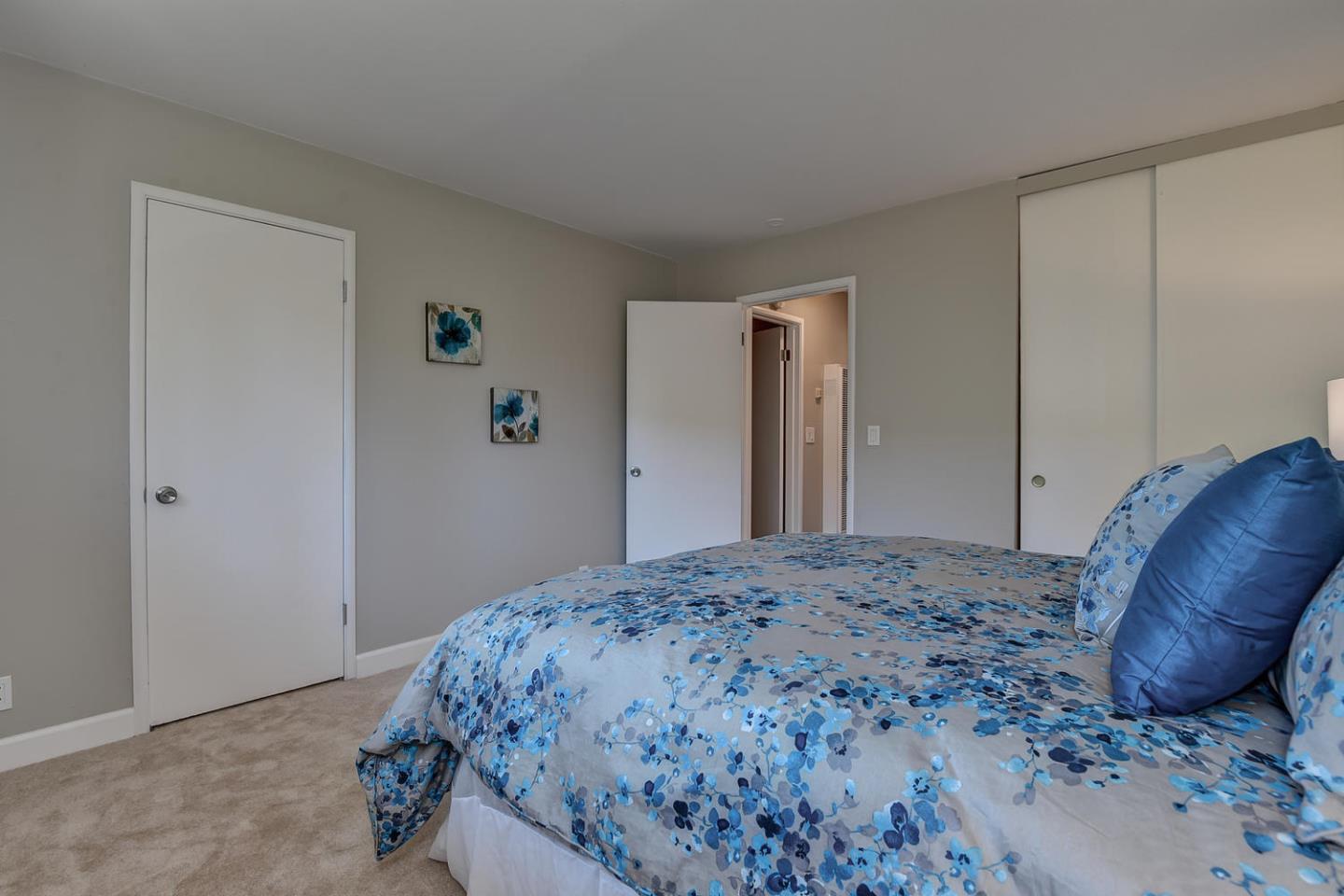 836 Pomeroy Avenue, Unit 70 Santa Clara, CA 95051 - Photo 12 of 17 a bedroom with a bed and a closet