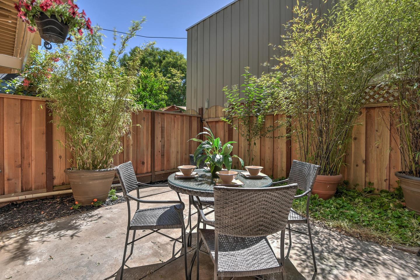 836 Pomeroy Avenue, Unit 70 Santa Clara, CA 95051 - Photo 14 of 17 a backyard of a house with table and chairs