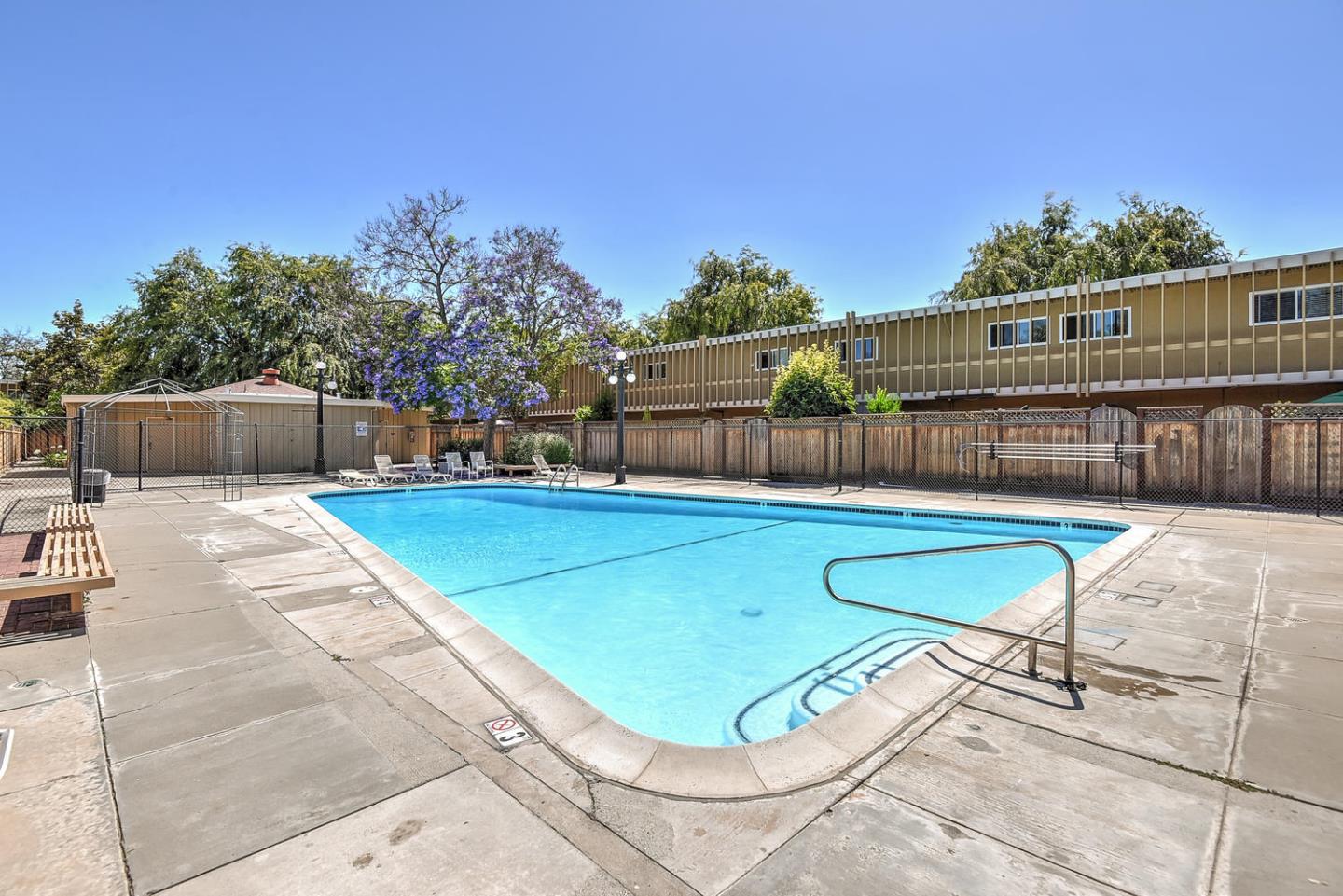 836 Pomeroy Avenue, Unit 70 Santa Clara, CA 95051 - Photo 17 of 17 a view of a chairs and table in the backyard