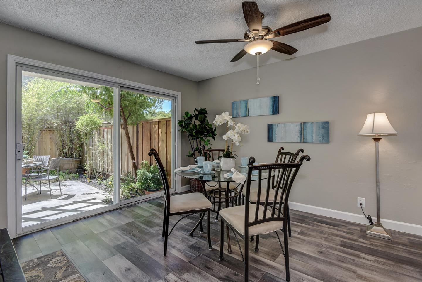 836 Pomeroy Avenue, Unit 70 Santa Clara, CA 95051 - Photo 4 of 17 a view of a dining room with furniture window and wooden floor