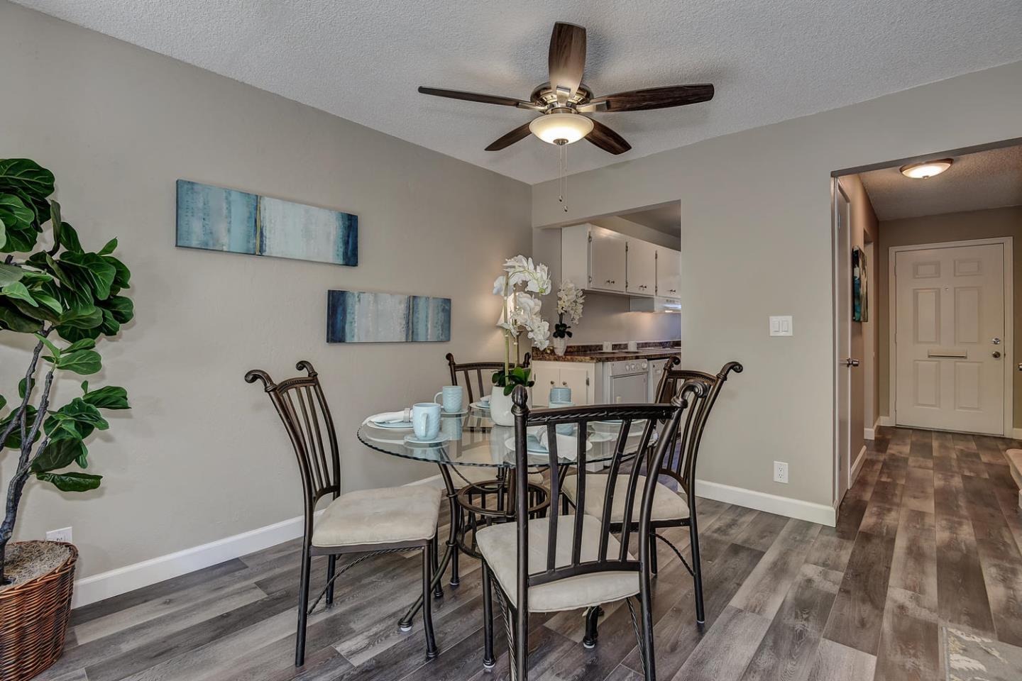 836 Pomeroy Avenue, Unit 70 Santa Clara, CA 95051 - Photo 6 of 17 a view of a dining room with furniture and wooden floor