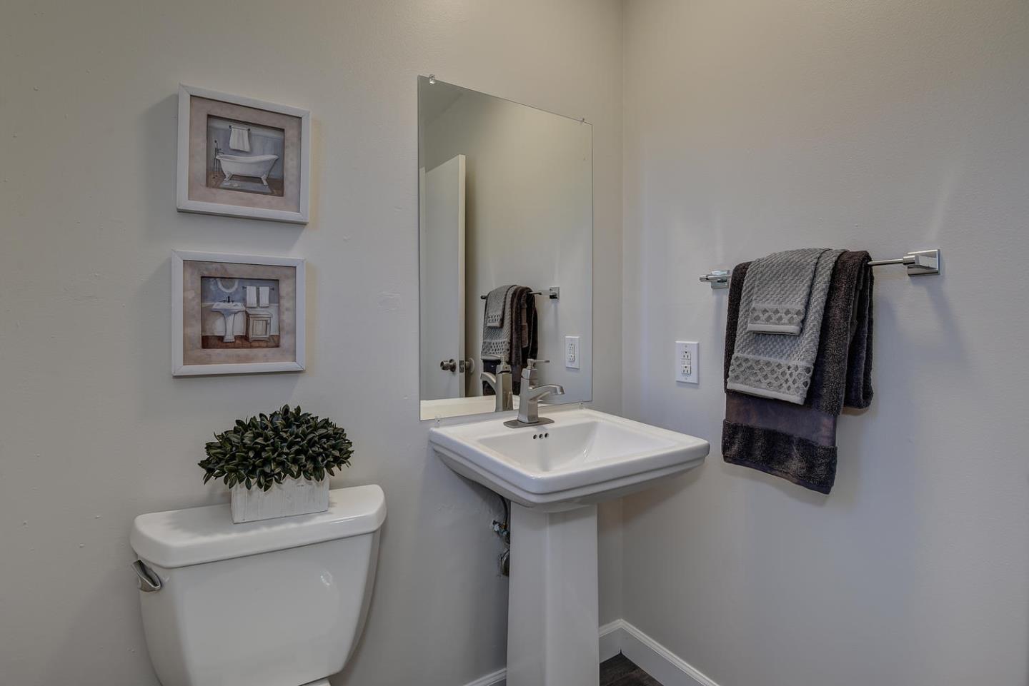 836 Pomeroy Avenue, Unit 70 Santa Clara, CA 95051 - Photo 9 of 17 a bathroom with a toilet a sink and mirror