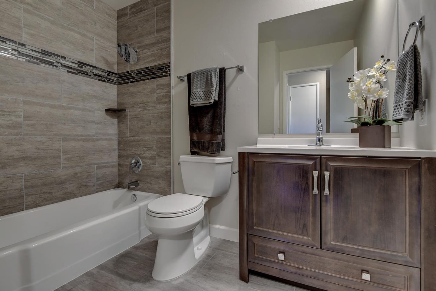 836 Pomeroy Avenue, Unit 70 Santa Clara, CA 95051 - Photo 10 of 17 a bathroom with a sink a toilet and shower