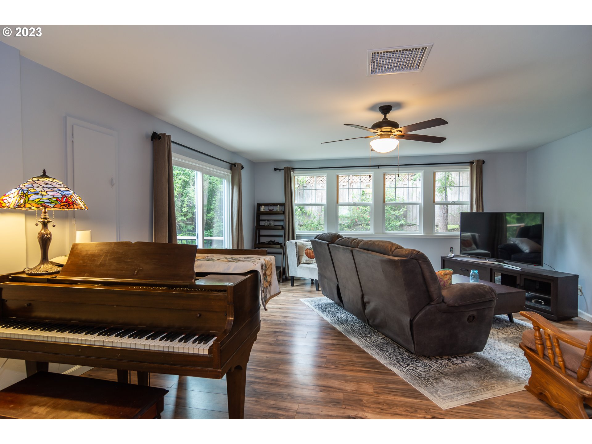 11533 Tyee Road Umpqua, OR 97486 - Photo 11 of 45 a living room with furniture fireplace and a large window