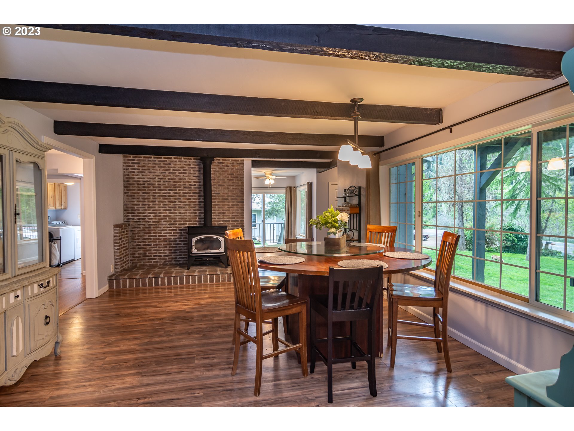 11533 Tyee Road Umpqua, OR 97486 - Photo 17 of 45 a view of a dining room with furniture window and wooden floor