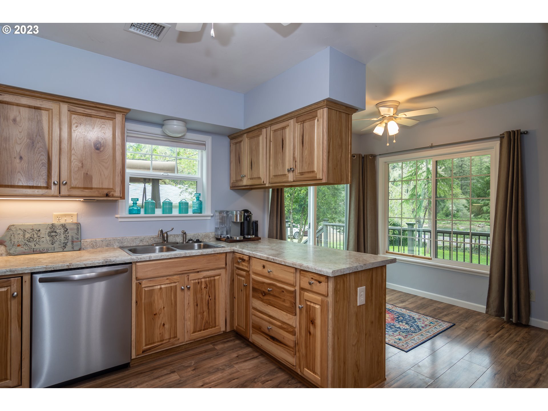 11533 Tyee Road Umpqua, OR 97486 - Photo 19 of 45 a kitchen with a sink a window and cabinets