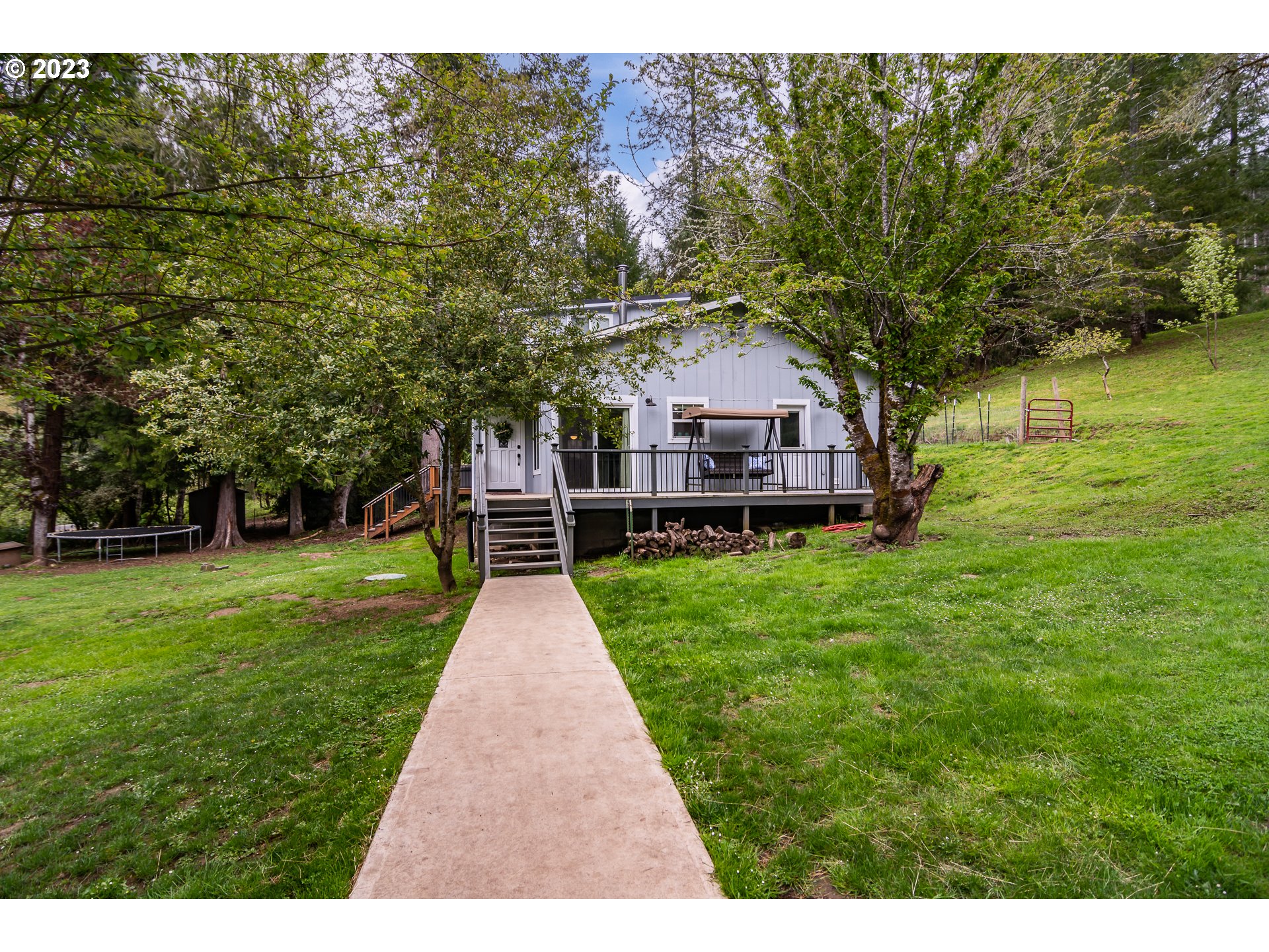 11533 Tyee Road Umpqua, OR 97486 - Photo 2 of 45 a house view with a garden space