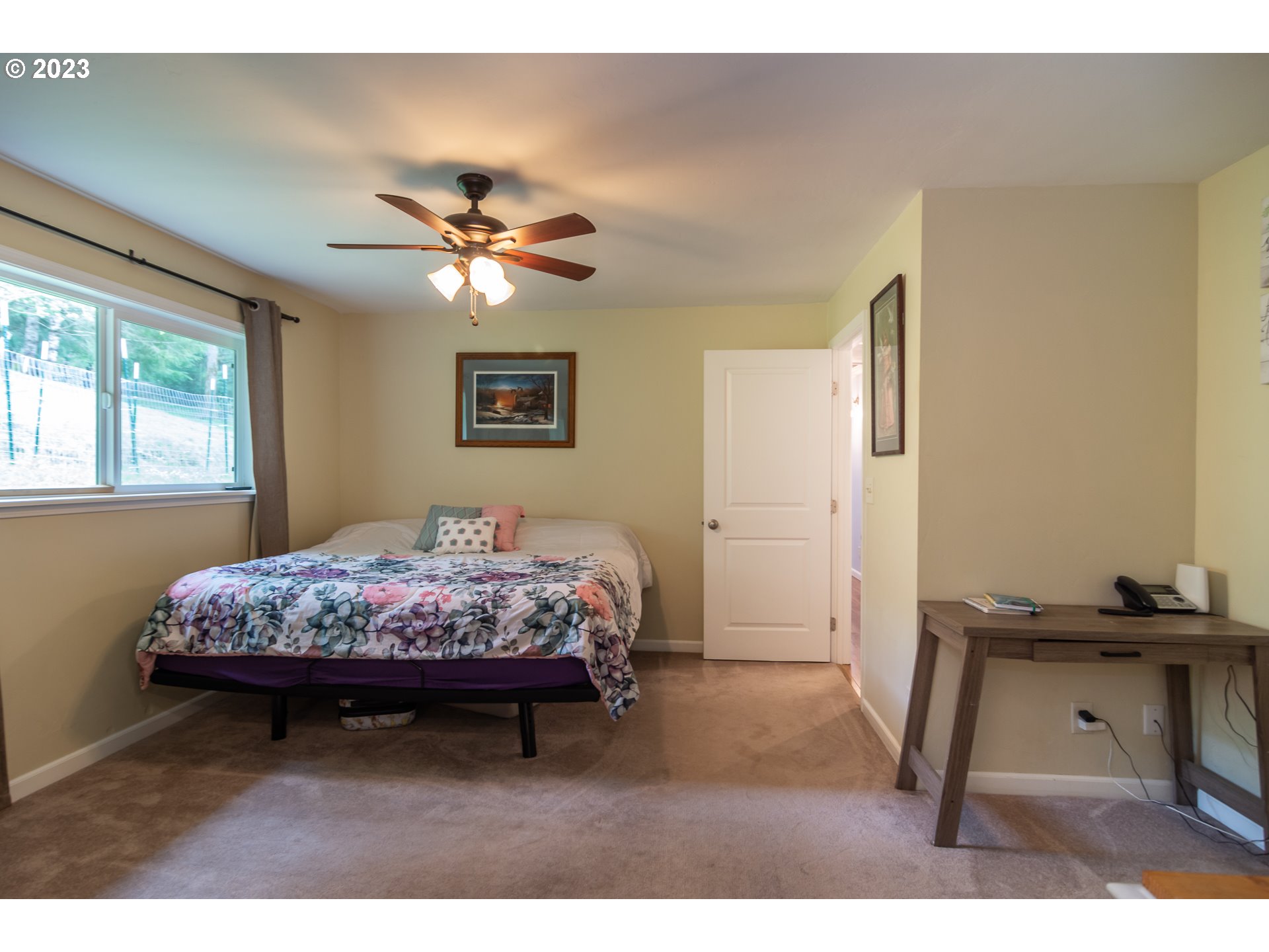 11533 Tyee Road Umpqua, OR 97486 - Photo 22 of 45 a bed room with a bed and a window