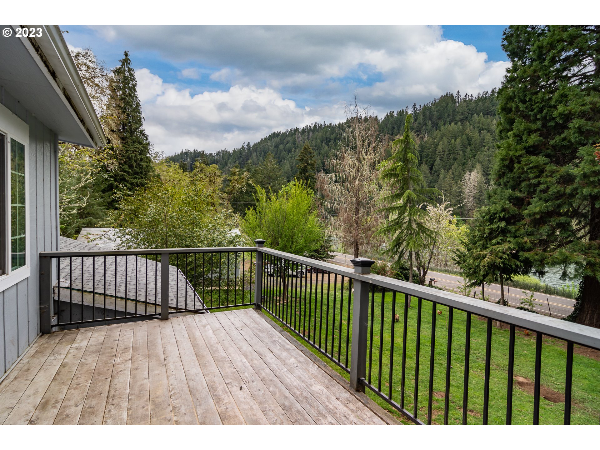 11533 Tyee Road Umpqua, OR 97486 - Photo 37 of 45 a view of balcony with wooden floor and fence