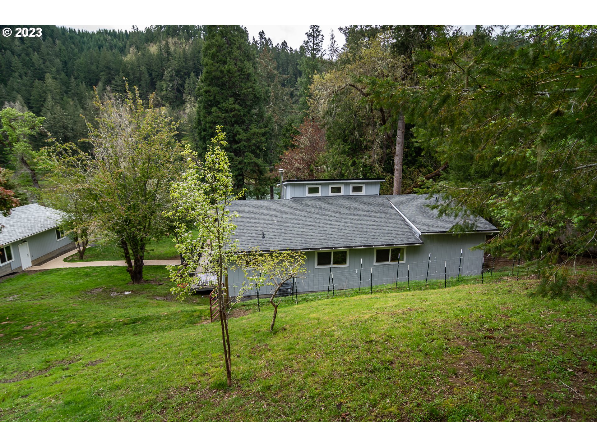 11533 Tyee Road Umpqua, OR 97486 - Photo 40 of 45 a view of a house with a yard
