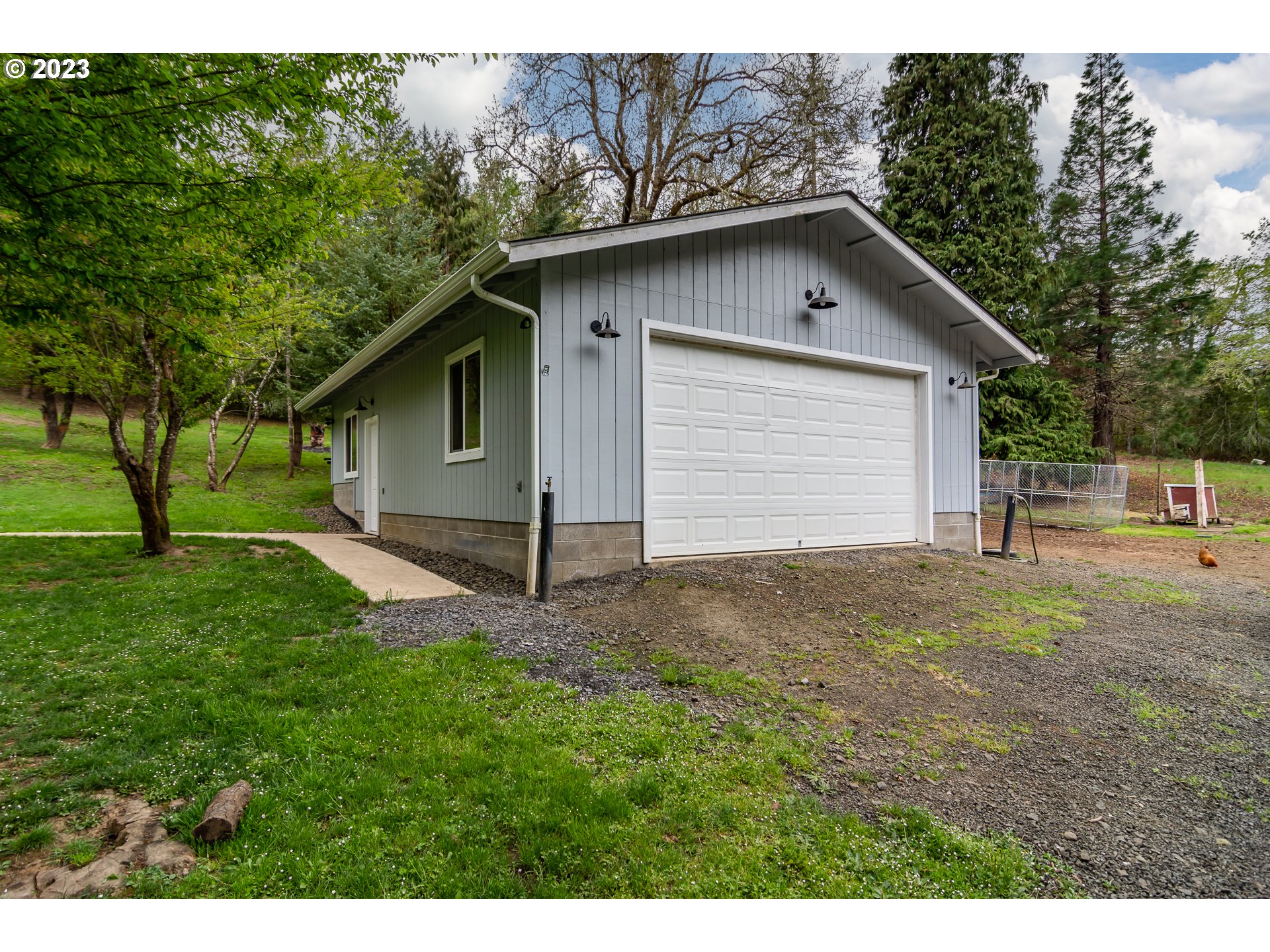 11533 Tyee Road Umpqua, OR 97486 - Photo 5 of 45 a house with green field in front of it