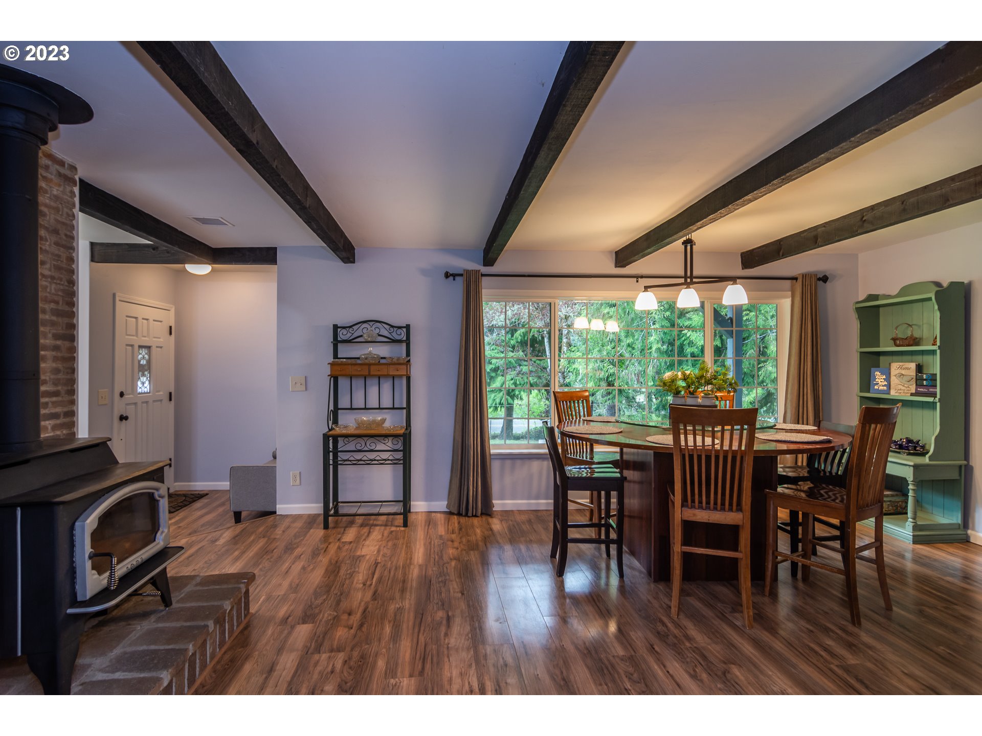 11533 Tyee Road Umpqua, OR 97486 - Photo 8 of 45 a view of a dining room with furniture window and wooden floor