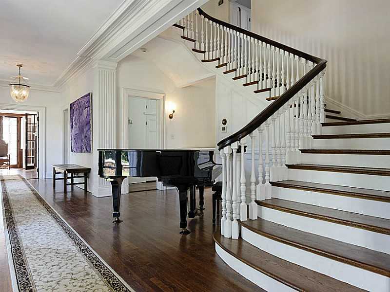 487 North Street Greenwich, CT 06830 - Photo 3 of 10 a view of entryway and dining room and hall with wooden floor