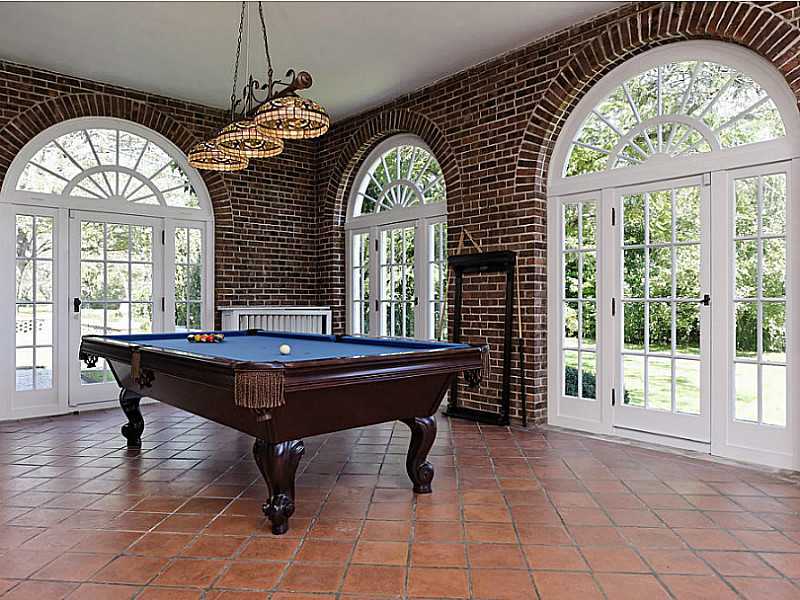 487 North Street Greenwich, CT 06830 - Photo 5 of 10 a room with a large window and a chandelier